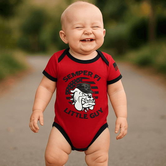 Adorable baby in a red Marines bodysuit with Semper Fi and a bulldog graphic, showcasing Marine pride.