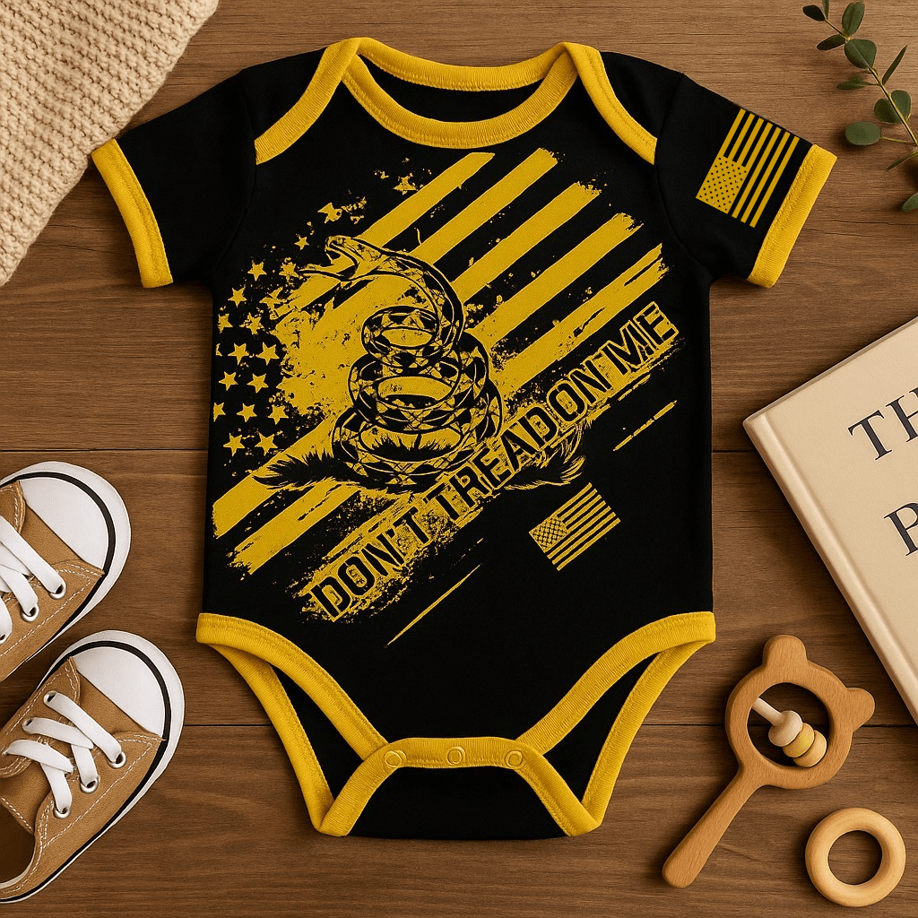 Don't Tread On Me Patriotic Baby Bodysuit in black and yellow with snake and flag design.