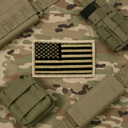 American Flag Patch on tan and black background, symbolizing patriotism and national pride with red, white, and blue colors.