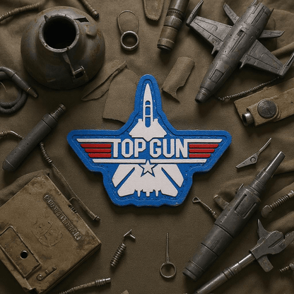 Top Gun F-14 Tomcat Jet blue PVC Patch surrounded by vintage military items.