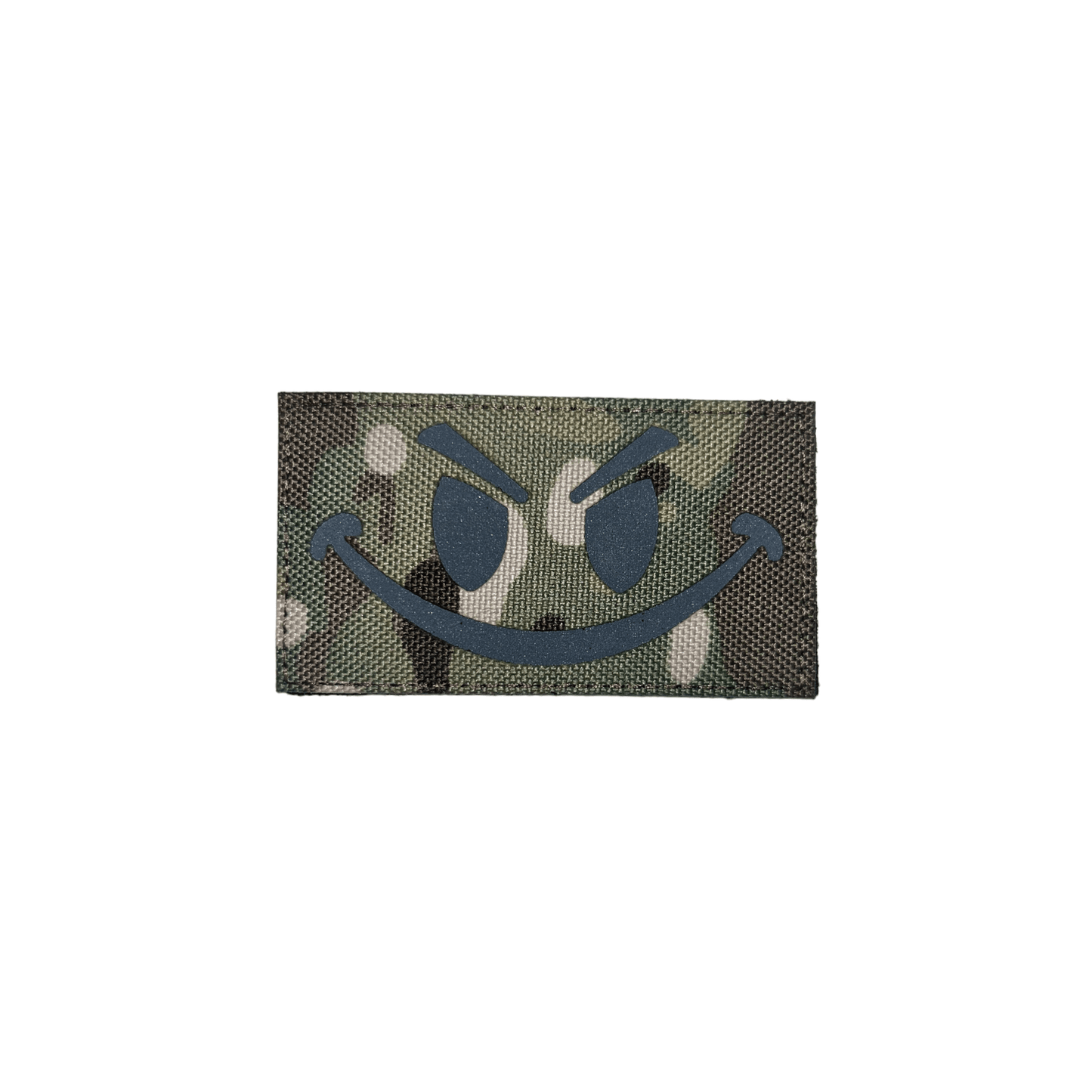 Camo smiley patch featuring a playful design on a green camouflage background.