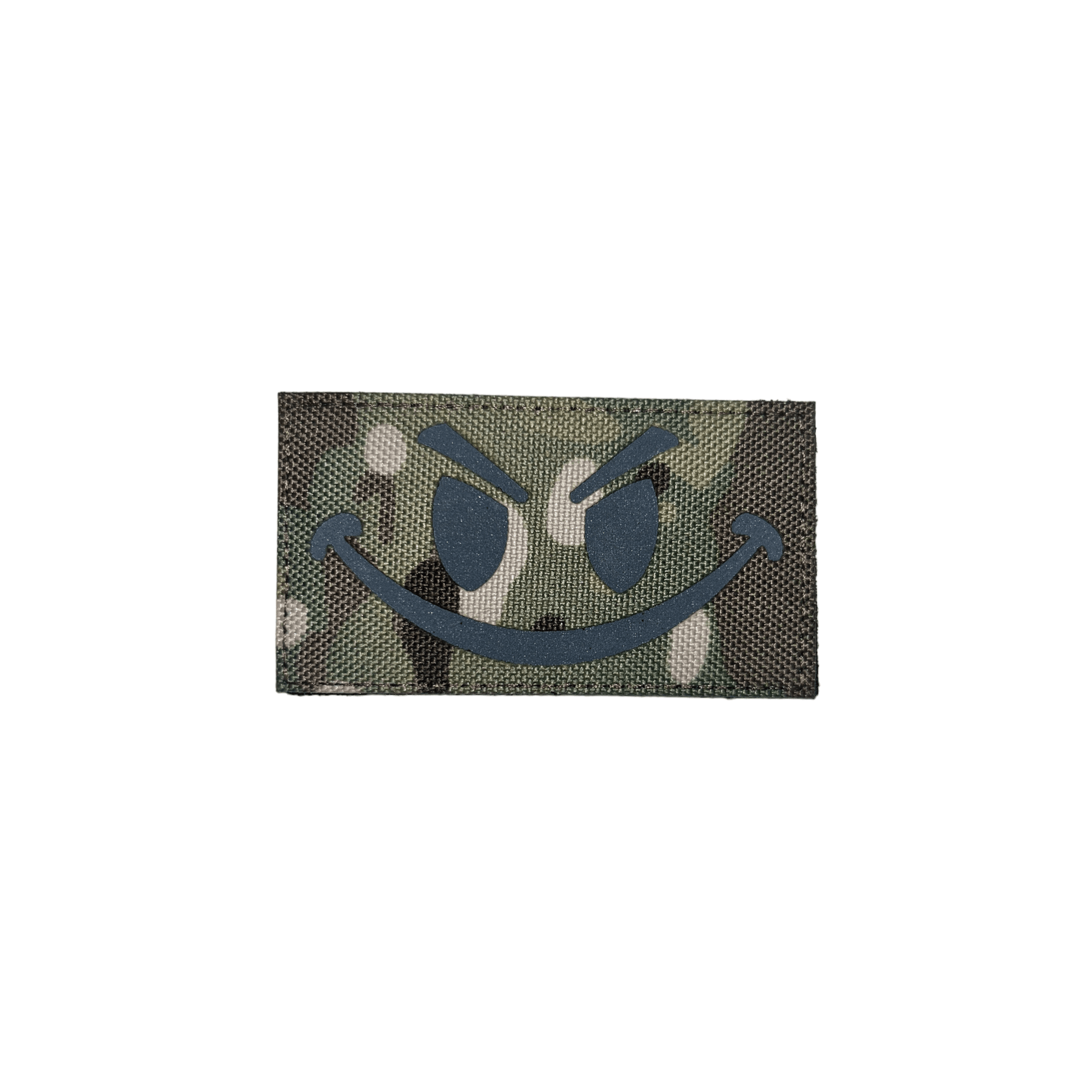 Camo smiley patch featuring a playful design on a green camouflage background.