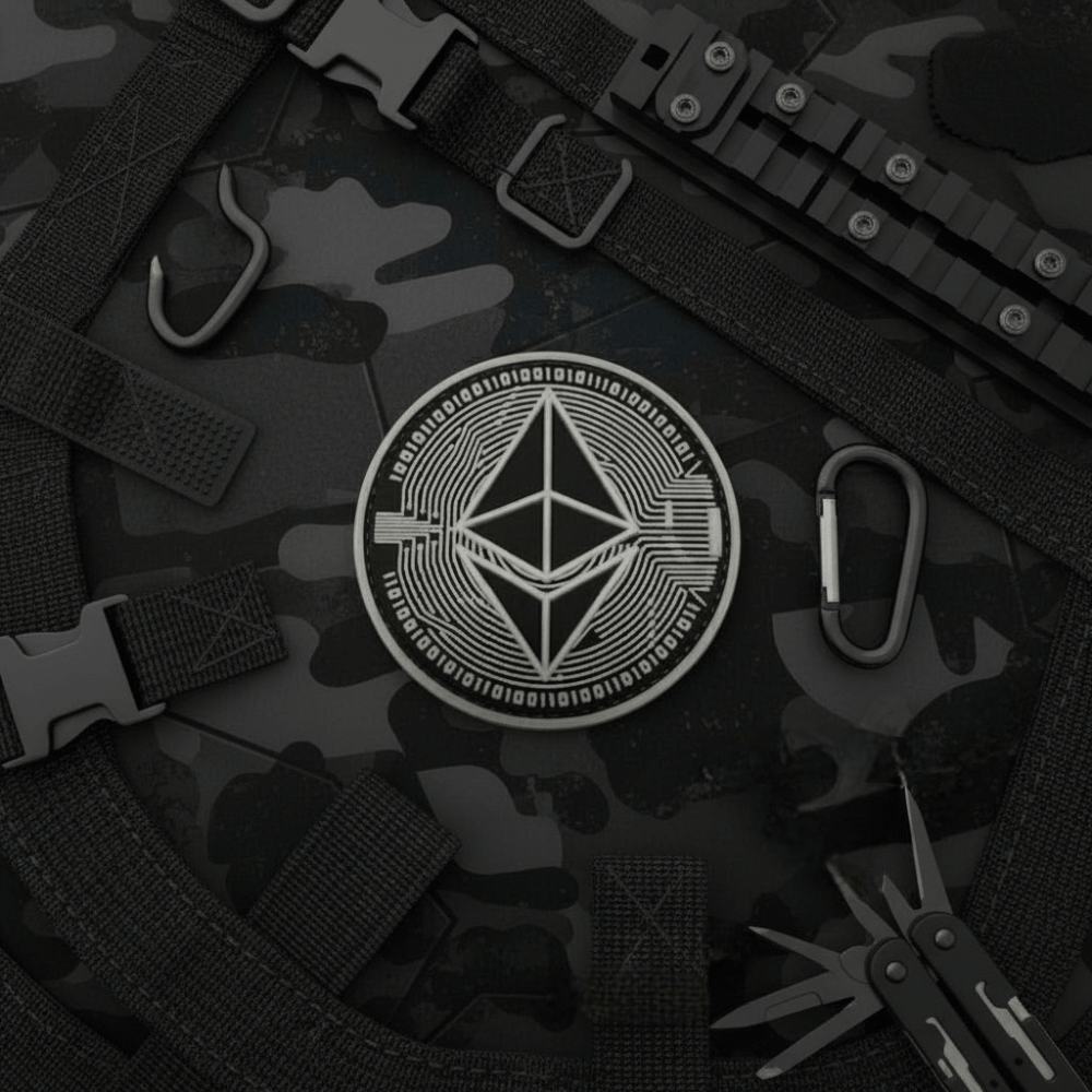 Ethereum PVC patch for gear on tactical background with military accessories