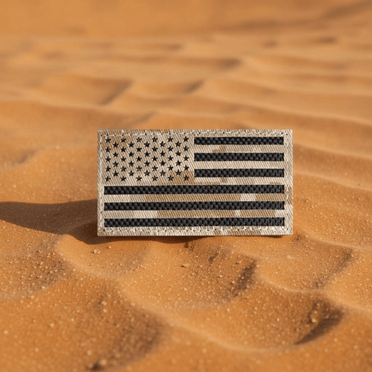 Laser Cut Desert MARPAT American Flag Patch on sandy background, showcasing detailed design and patriotic appeal.