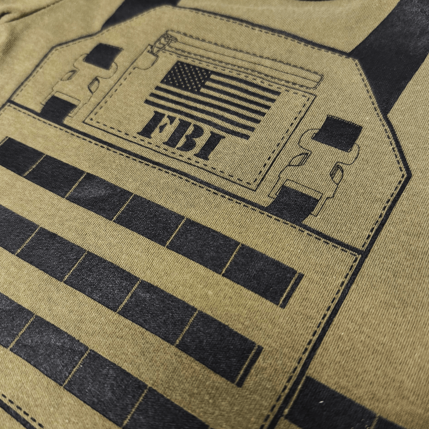 Close-up of screen-printed flak jacket design on FBI Baby Flak Jacket Baby Bodysuit with American flag detail.