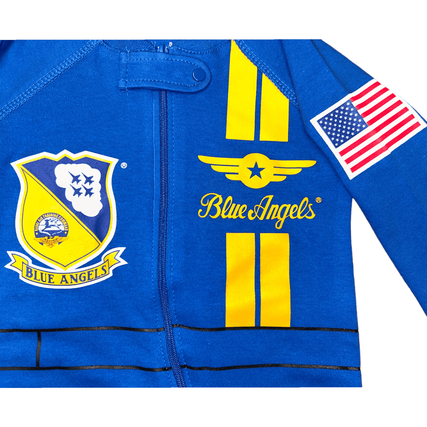 Close-up of Blue Angels baby flight suit with logo patches and American flag design.