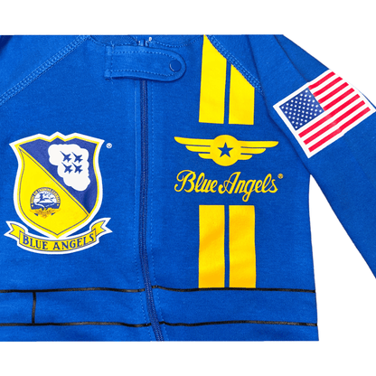Close-up of Blue Angels baby flight suit with logo patches and American flag design.