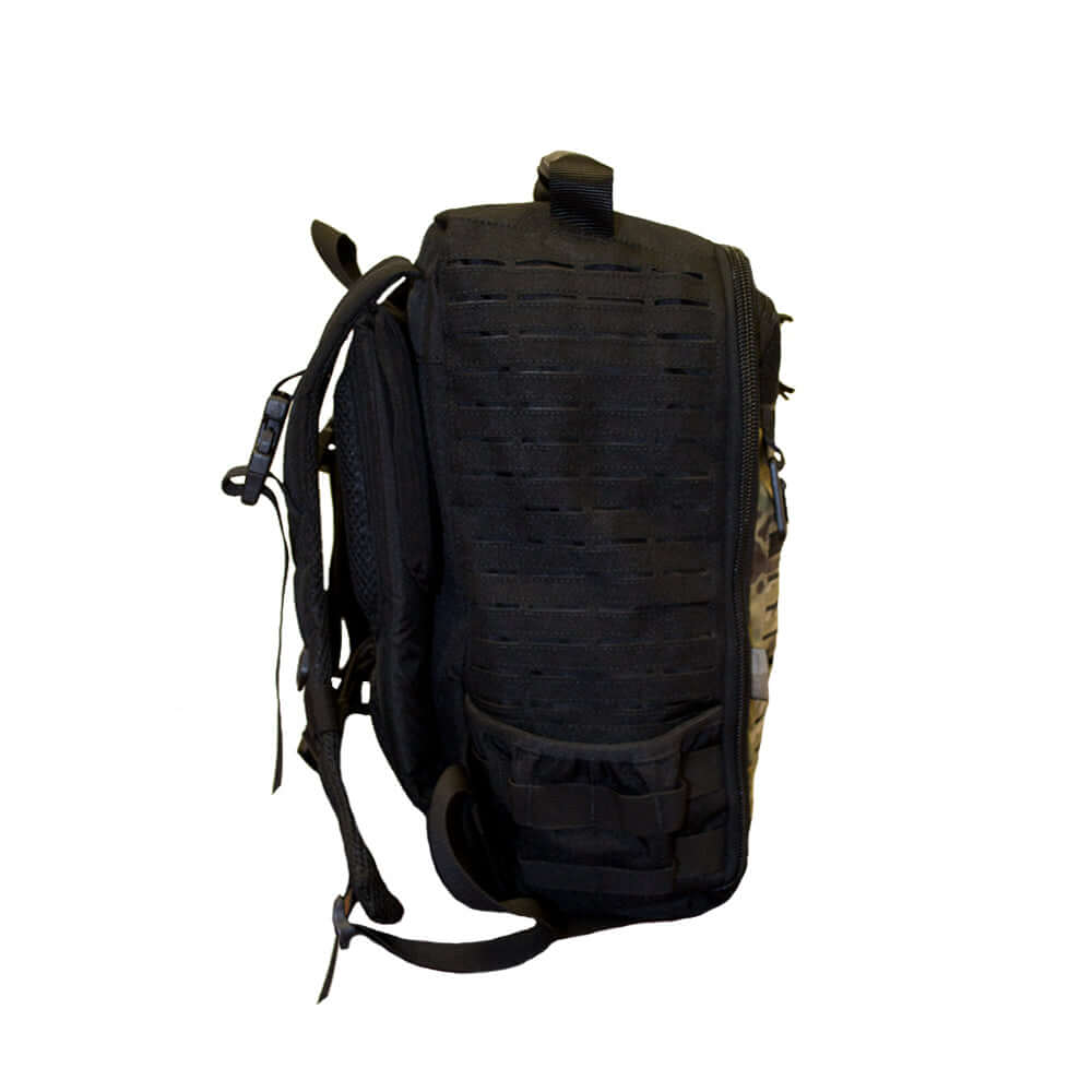Diaper-Bag Multicam Black Tacticool shown from the side, featuring a laser cut molle grid for versatility.